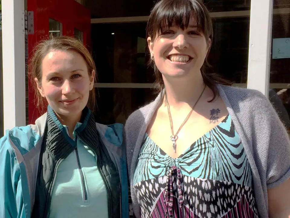 Two people smiling at the camera at SEND Project